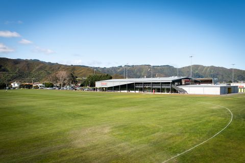 Picture of sports ground with building in the background