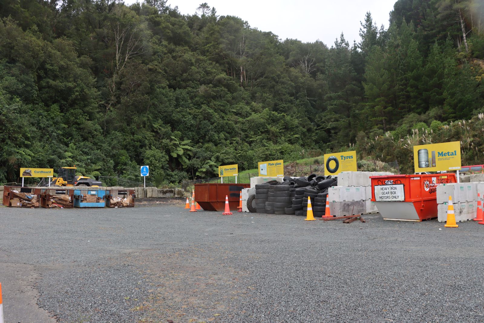 Recycling bins for mixed materials in a waste collection area banner image