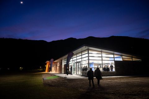 Te Matauraura o Whenuangaro Centre at Te Whiti Park - building lit up against a dark sky