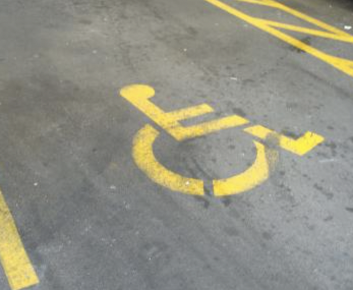 Mobility parking sign in yellow