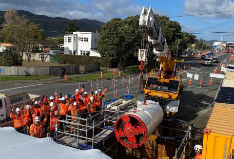 The team of engineers gathers as Te Rū is lowered into the ground for the first time.